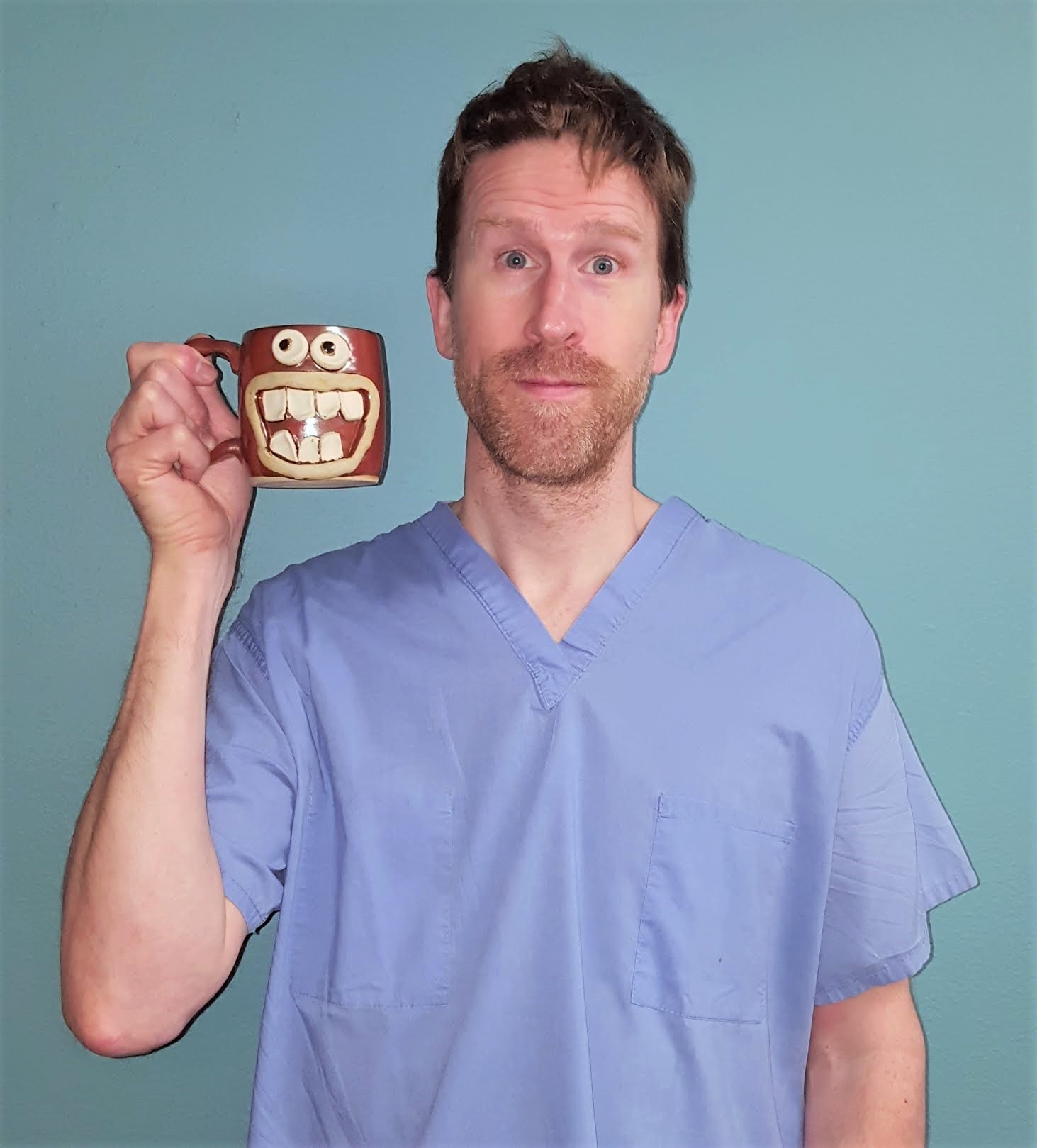 Dr. Watson standing with a mug in his hand